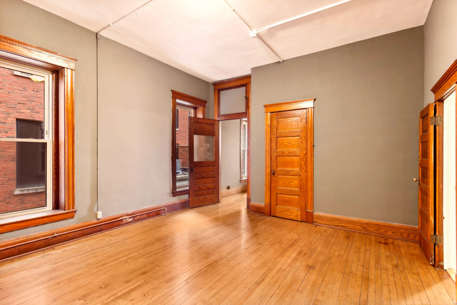 169 South Schuyler Avenue, Unit 34 Kankakee, IL 60901 - Photo 12 of 19 an empty room with wooden floor and closet