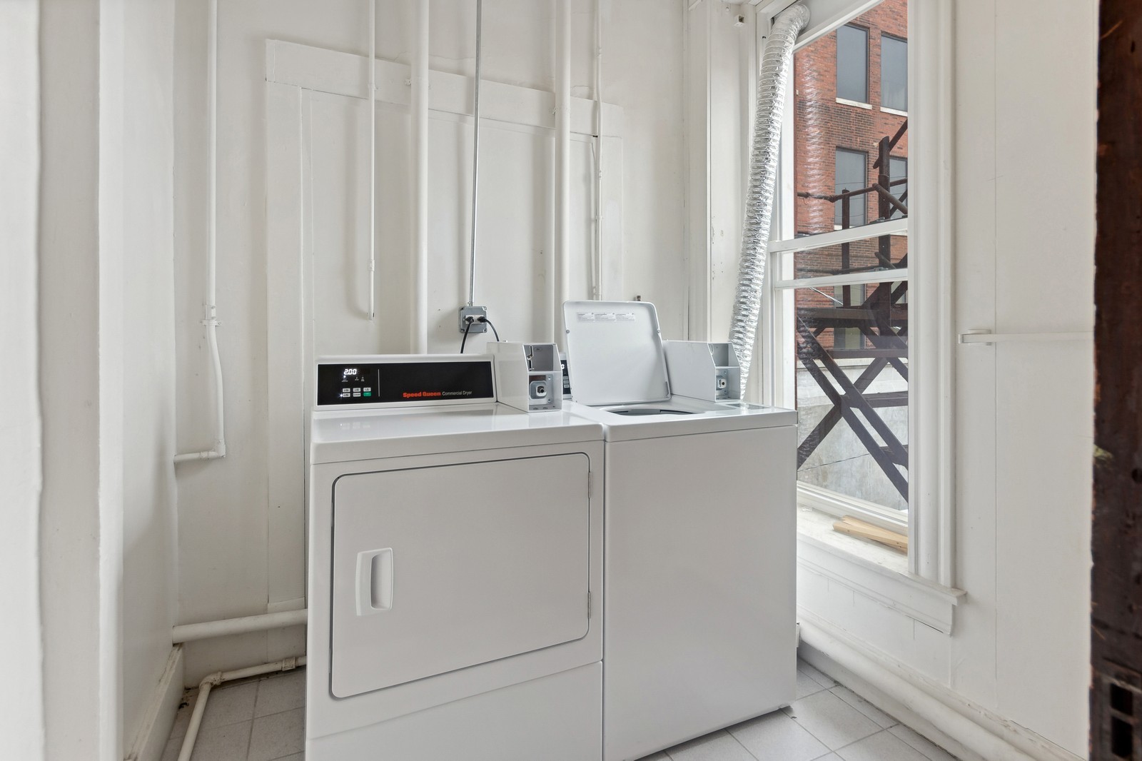 169 South Schuyler Avenue, Unit 34 Kankakee, IL 60901 - Photo 17 of 19 a kitchen with appliances cabinets and a window
