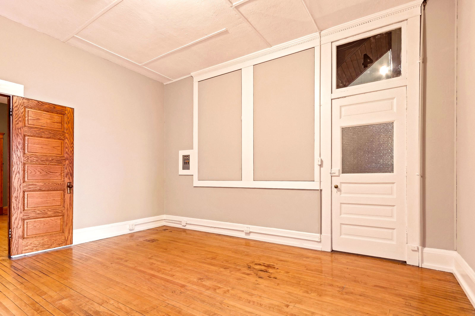 169 South Schuyler Avenue, Unit 34 Kankakee, IL 60901 - Photo 9 of 19 a view of an empty room with cabinet and wooden floor