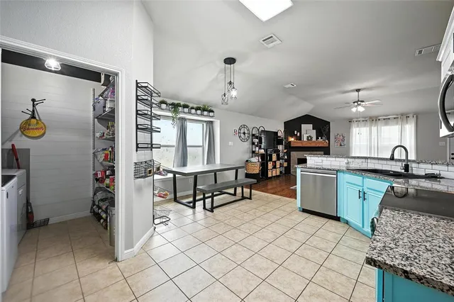 a kitchen with sink cabinets and window