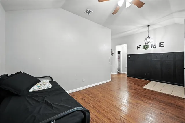a living room with hard wood floors