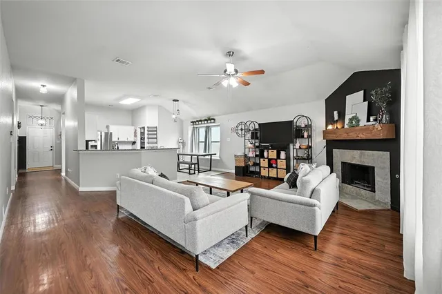 a living room with furniture and a fireplace