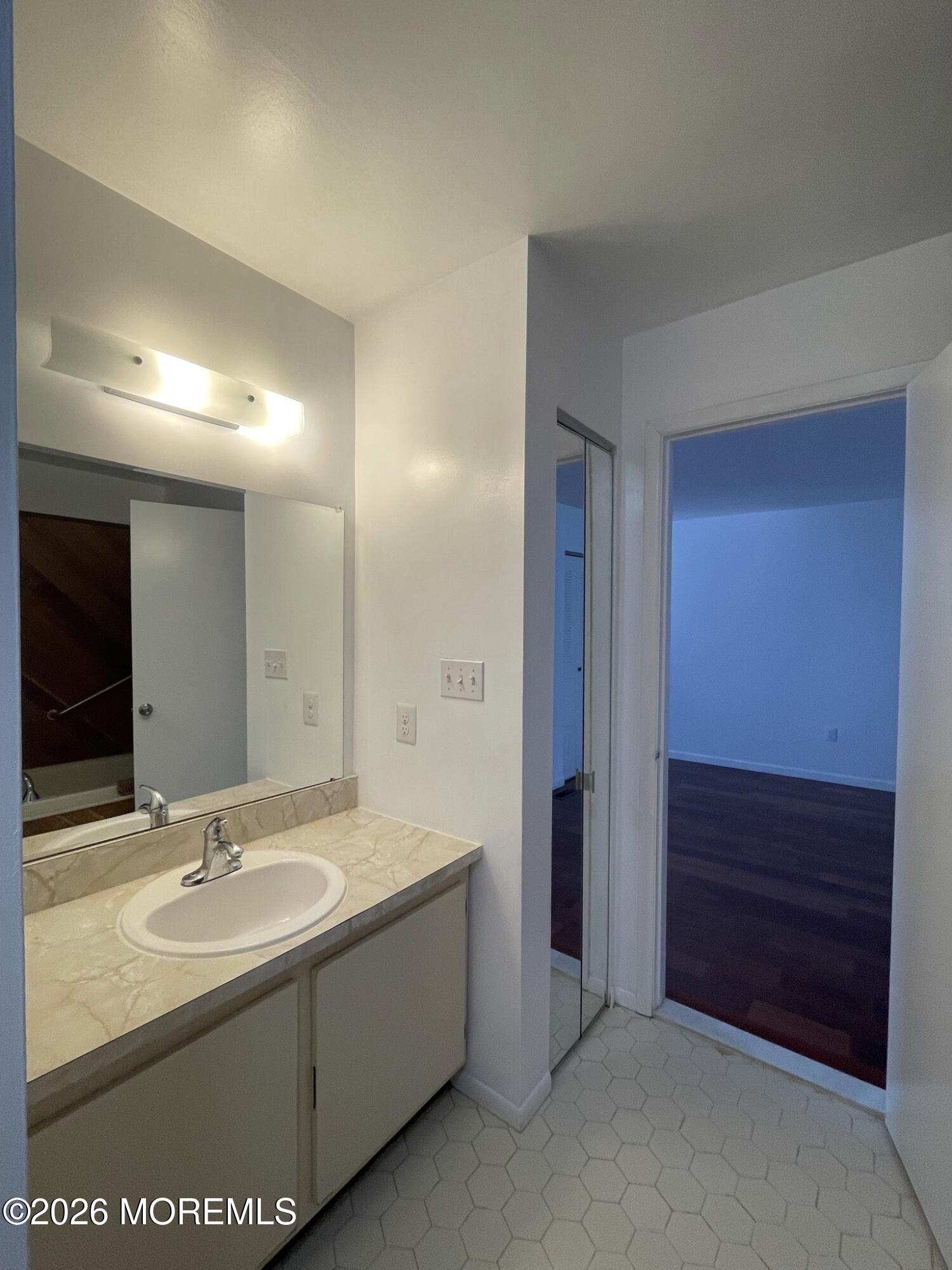 19 Clavendon Court Middletown, NJ 07748 - Photo 11 of 21 a bathroom with a sink and a mirror