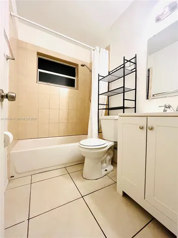 a bathroom with a sink a toilet and a bathtub