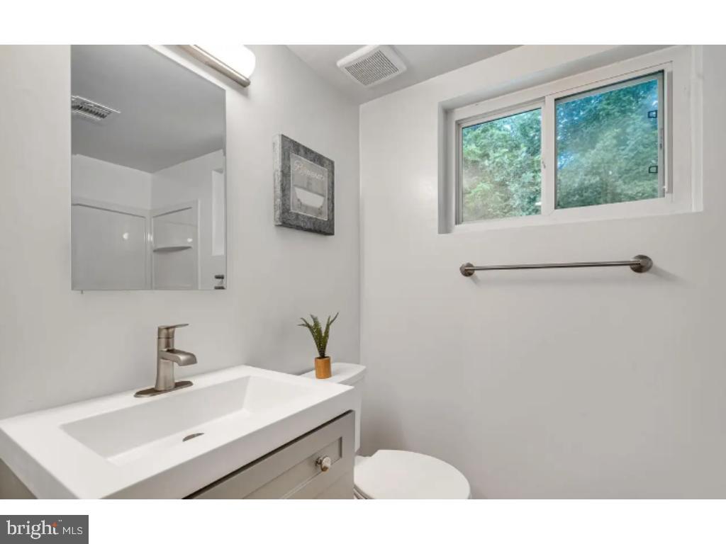 3919 Littleton Street Silver Spring, MD 20906 - Photo 15 of 17 a bathroom with a sink and a mirror