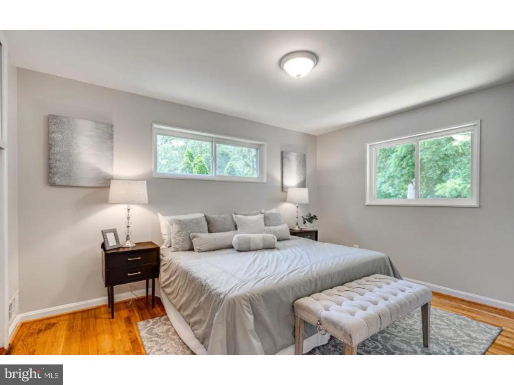 3919 Littleton Street Silver Spring, MD 20906 - Photo 7 of 17 a bedroom with two beds and a window