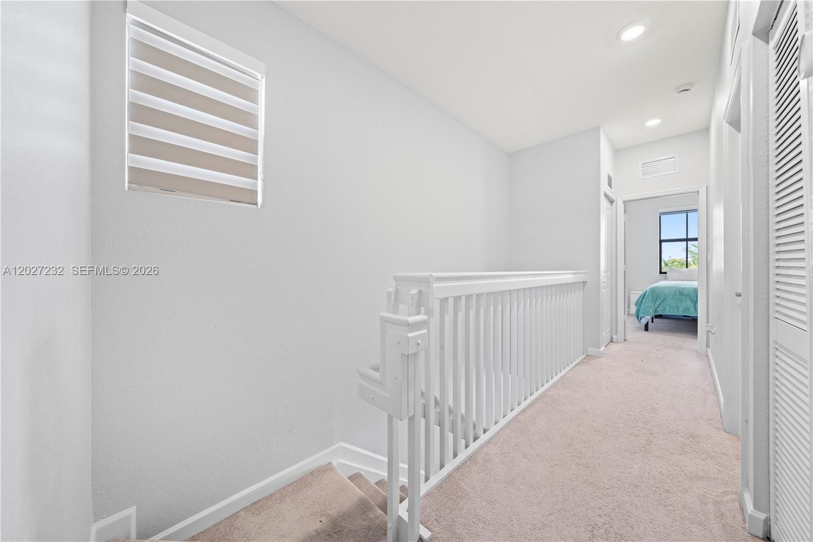 23489 Southwest 127th Place Homestead, FL 33032 - Photo 17 of 24 a view of a hallway with workspace