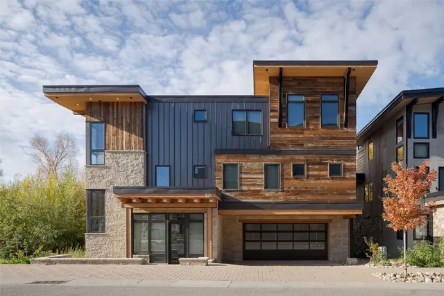 a front view of a house with a garage