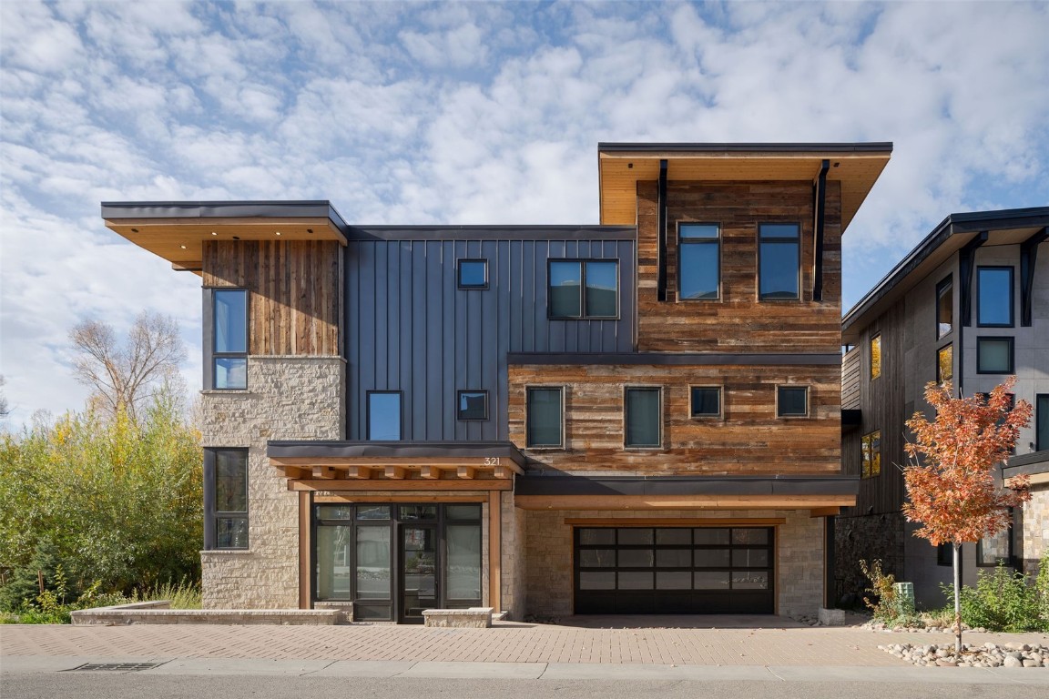 a front view of a house with a garage