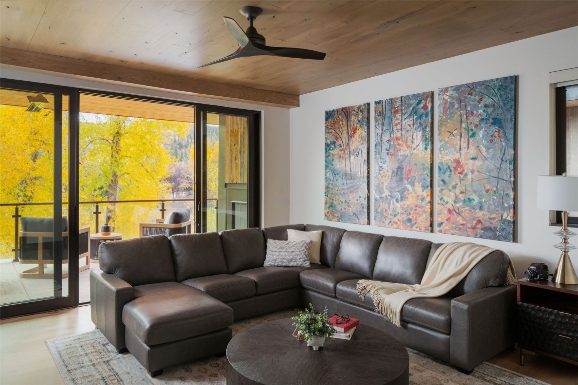 321 Riverview Way Steamboat Springs, CO 80487 - Photo 20 of 50 a living room with furniture and a large window