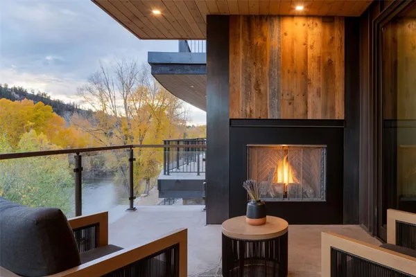 a room with furniture a chandelier and a window