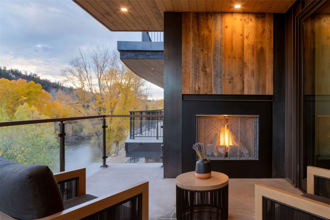 321 Riverview Way Steamboat Springs, CO 80487 - Photo 21 of 50 a room with furniture a chandelier and a window
