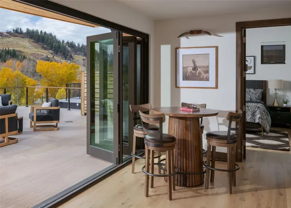 a view of a dining room with furniture window and outside view