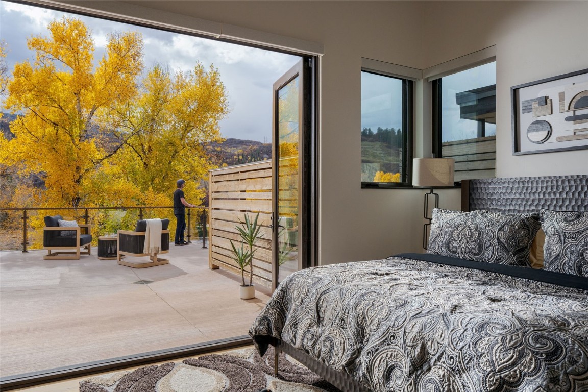 321 Riverview Way Steamboat Springs, CO 80487 - Photo 30 of 50 a bedroom with a bed and a painting on the wall