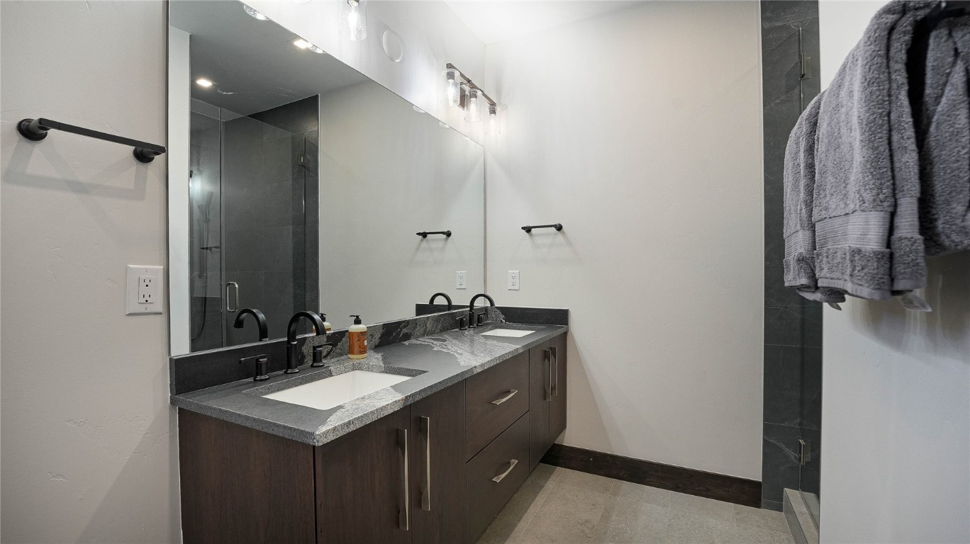 321 Riverview Way Steamboat Springs, CO 80487 - Photo 35 of 50 a bathroom with a sink and a mirror