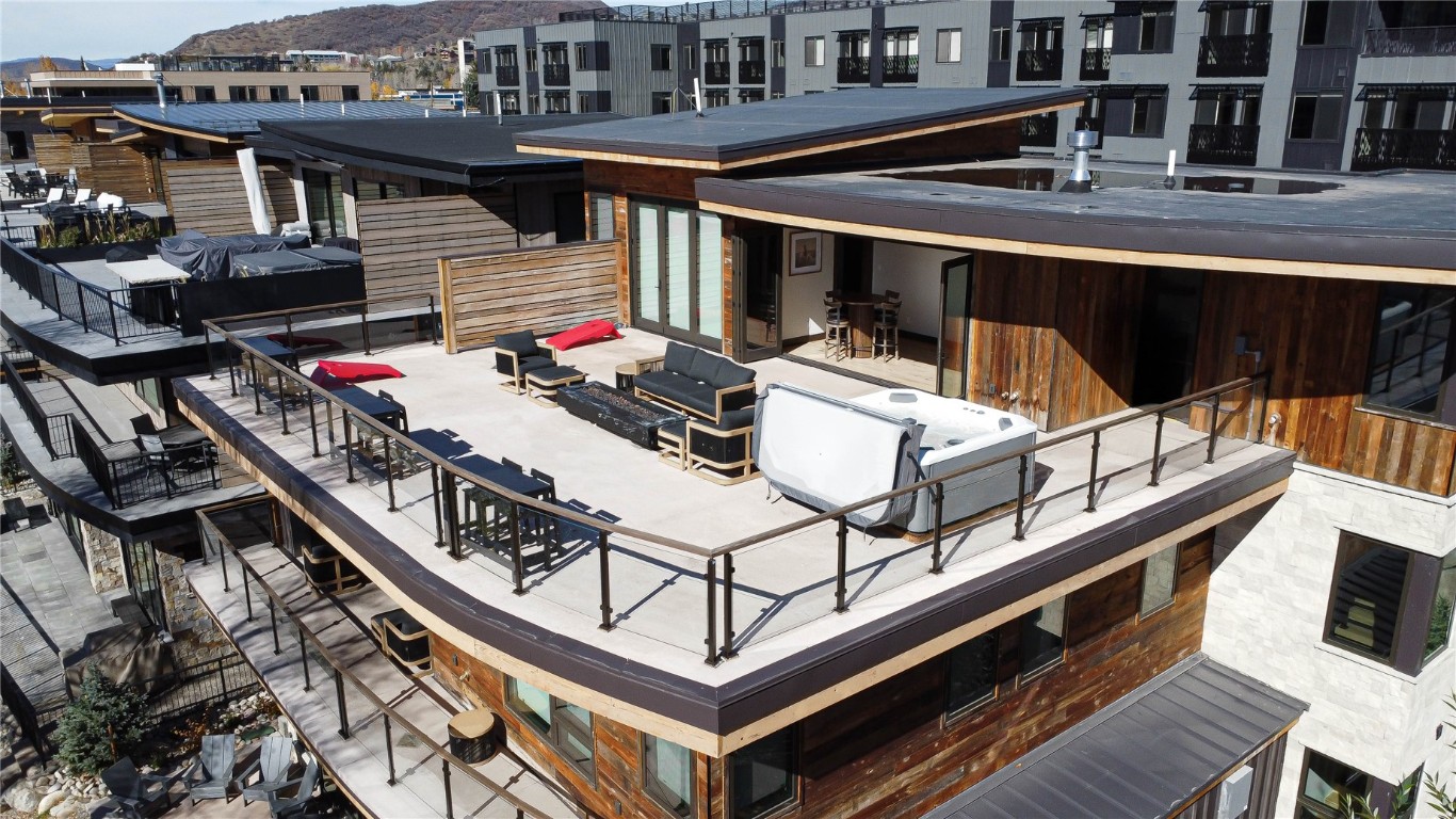 321 Riverview Way Steamboat Springs, CO 80487 - Photo 37 of 50 a view of a balcony with chairs and a potted plant