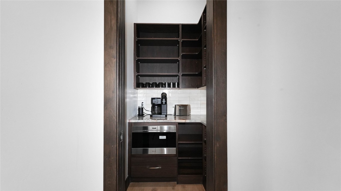 321 Riverview Way Steamboat Springs, CO 80487 - Photo 45 of 50 a kitchen with a refrigerator and a stove top oven