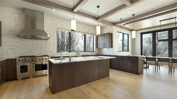 a kitchen with stainless steel appliances granite countertop a stove and a sink