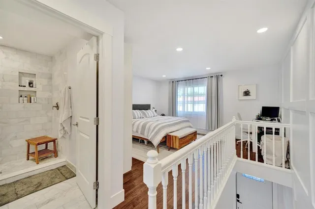 a bedroom with furniture and a window