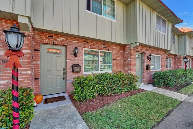 a front view of a building with garden