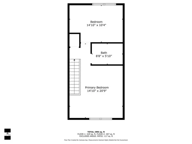 a picture of a bench in front of a wall