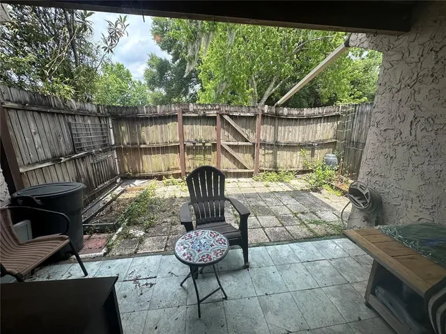 a view of a balcony with furniture
