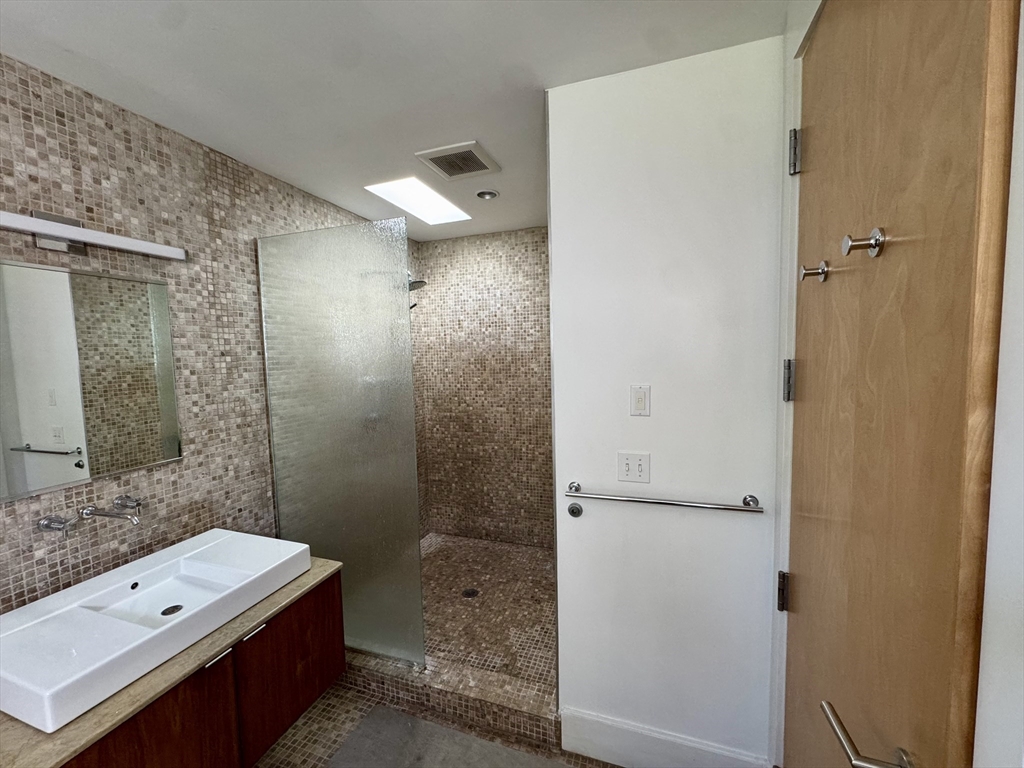 4 Solstice Way Sharon, MA 02067 - Photo 14 of 22 a bathroom with a double vanity sink toilet and shower