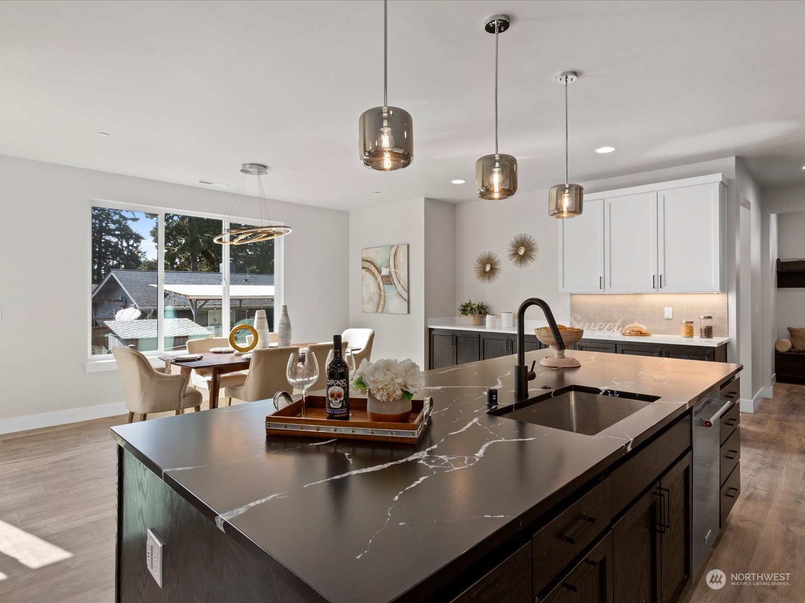 21615 1st Avenue West Bothell, WA 98021 - Photo 18 of 39 a kitchen with a sink a counter and chairs