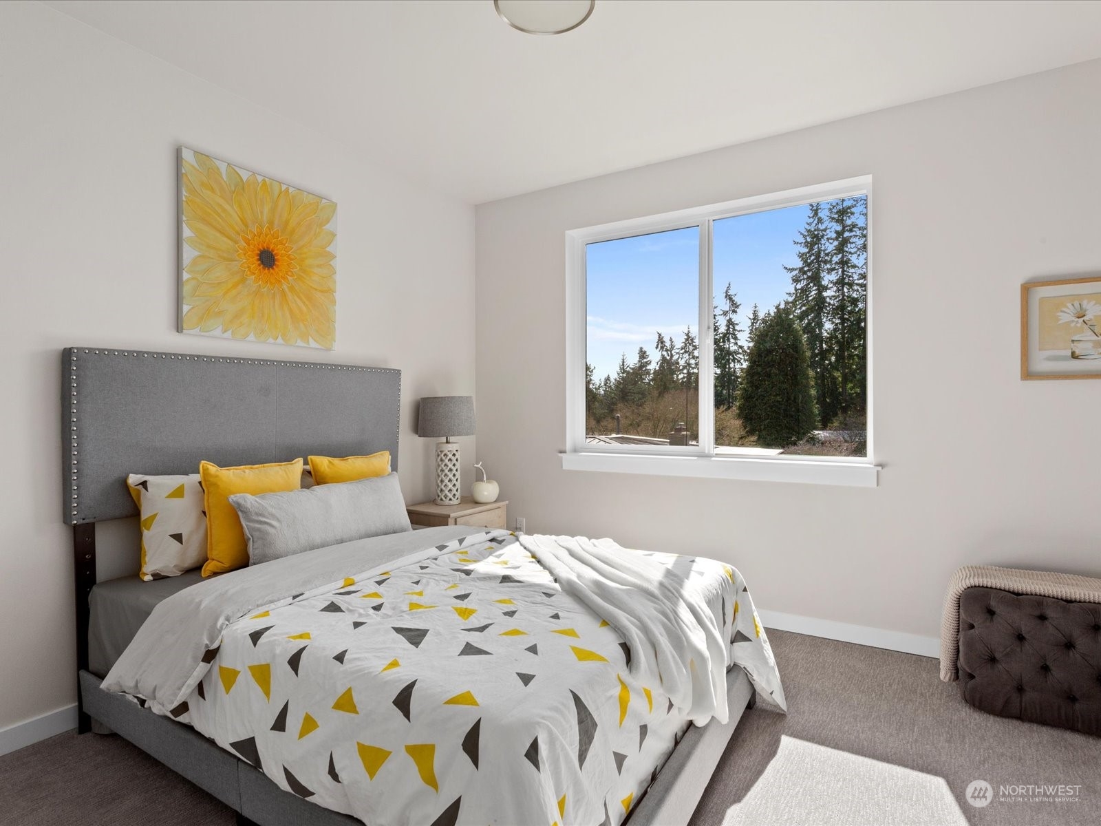 21615 1st Avenue West Bothell, WA 98021 - Photo 29 of 39 a bedroom with a bed a painting on the wall and a window