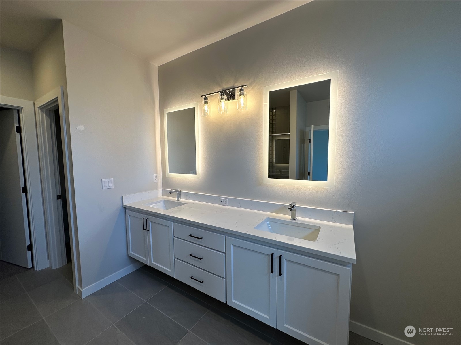 21615 1st Avenue West Bothell, WA 98021 - Photo 7 of 39 a bathroom with a double vanity sink and mirror