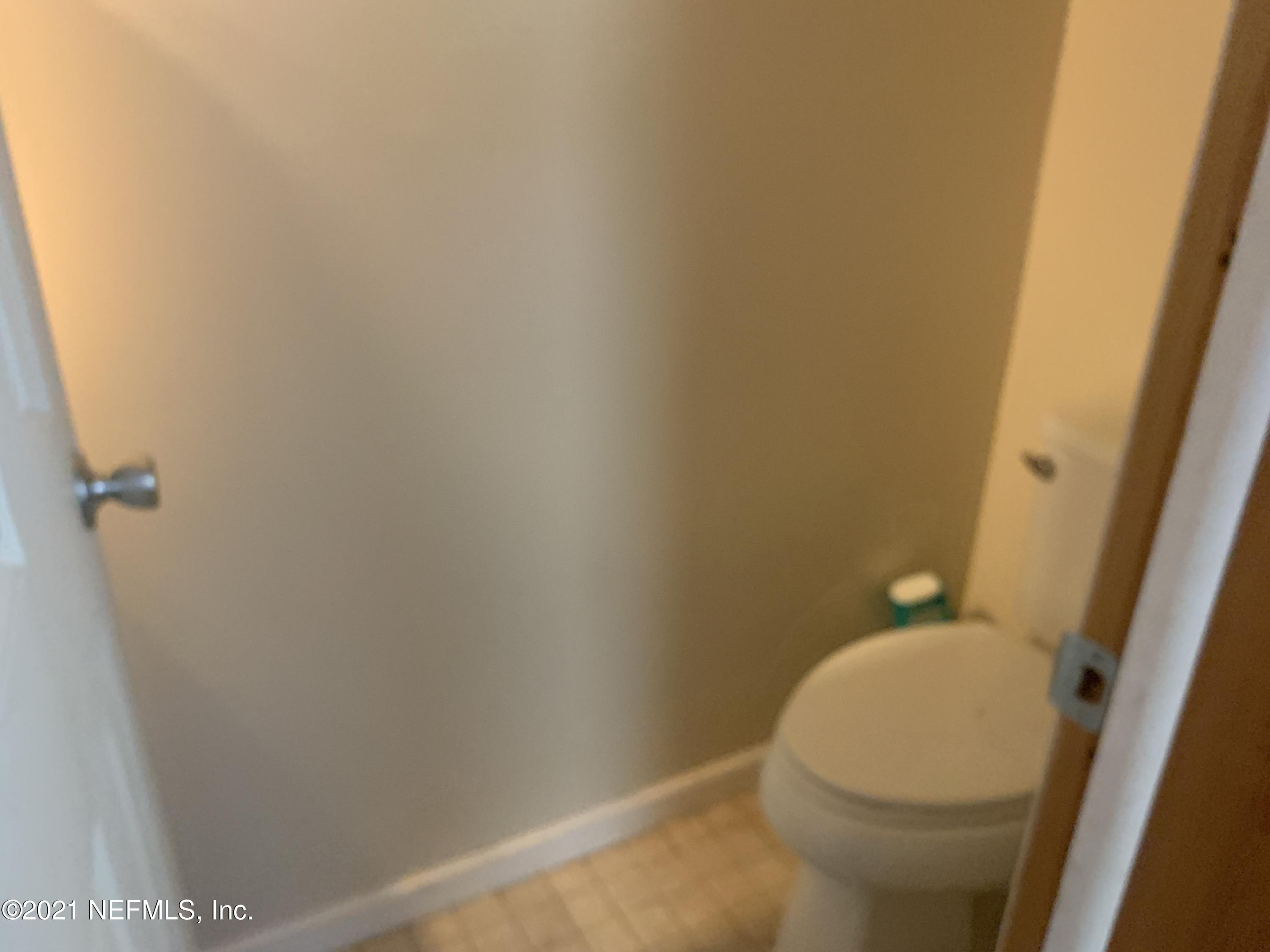 12505 Pulaski Road Jacksonville, FL 32218 - Photo 41 of 45 half bath in office/bedroom 3
