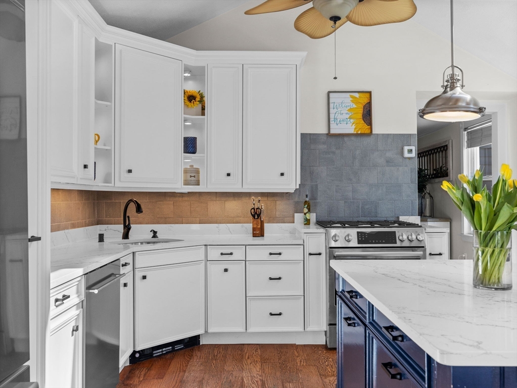 428 Washington Street Canton, MA 02021 - Photo 1 of 31 a kitchen with a white cabinets and chandelier