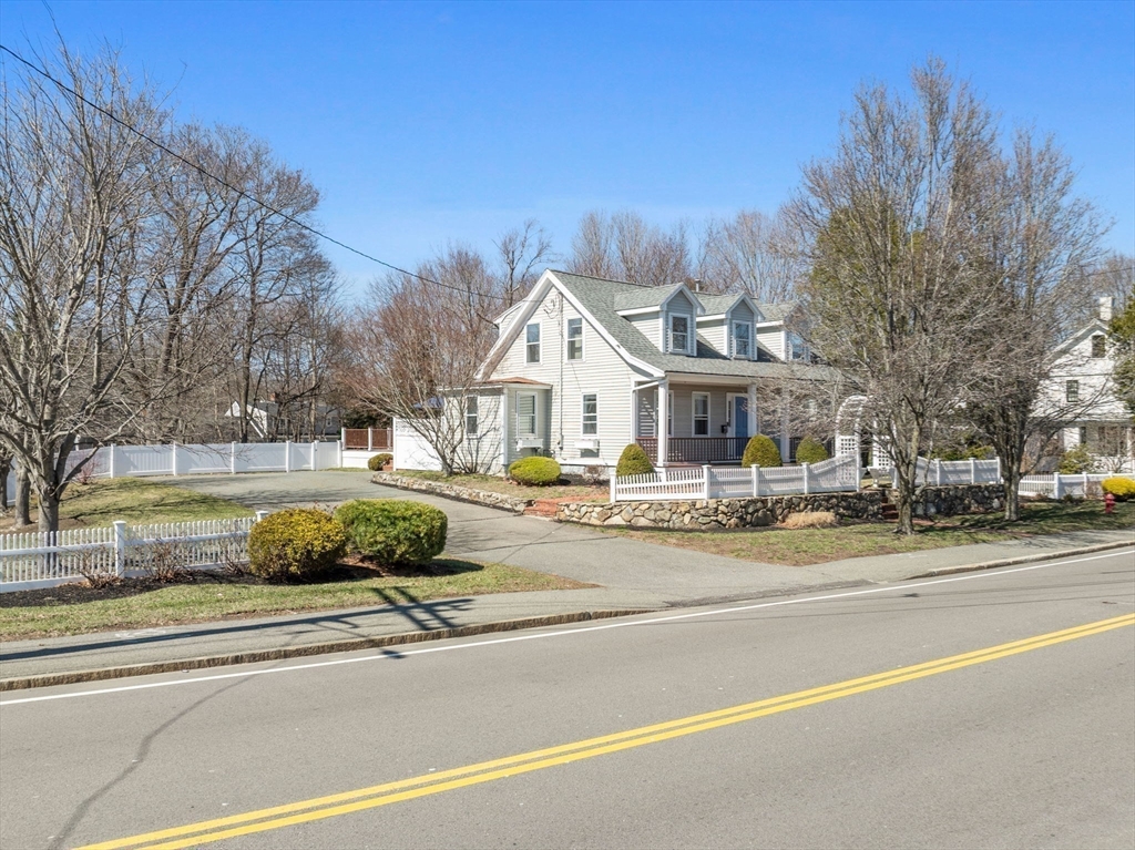428 Washington Street Canton, MA 02021 - Photo 25 of 31 a view of a white house with a fountain and a yard