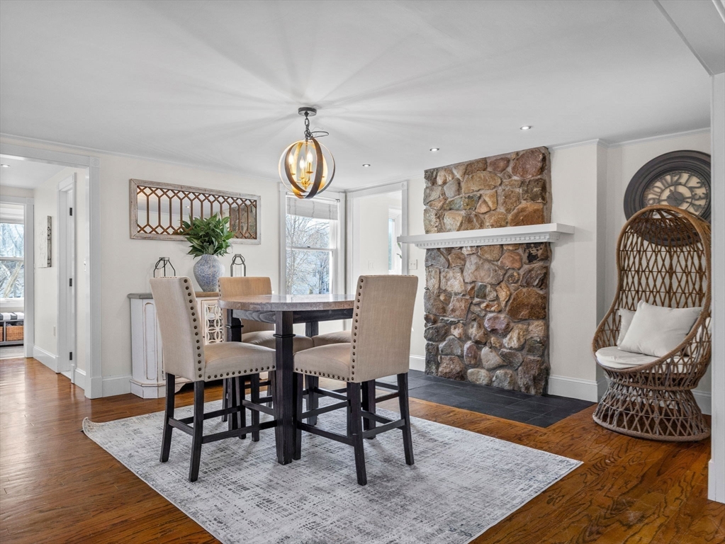428 Washington Street Canton, MA 02021 - Photo 5 of 31 a view of a dining room with furniture wooden floor and a rug