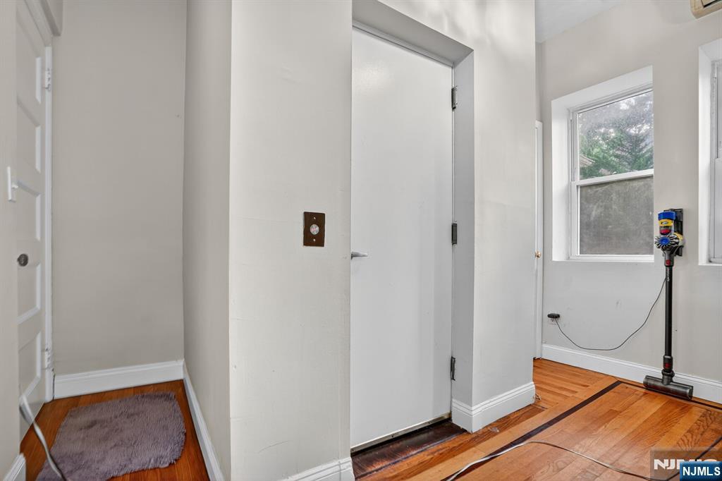 285 Maple Street Englewood, NJ 07631 - Photo 22 of 29 a view of room with wooden floor and front door