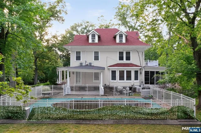 a front view of a house with a yard table and chairs