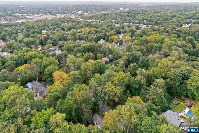 an aerial view of a houses with a yard