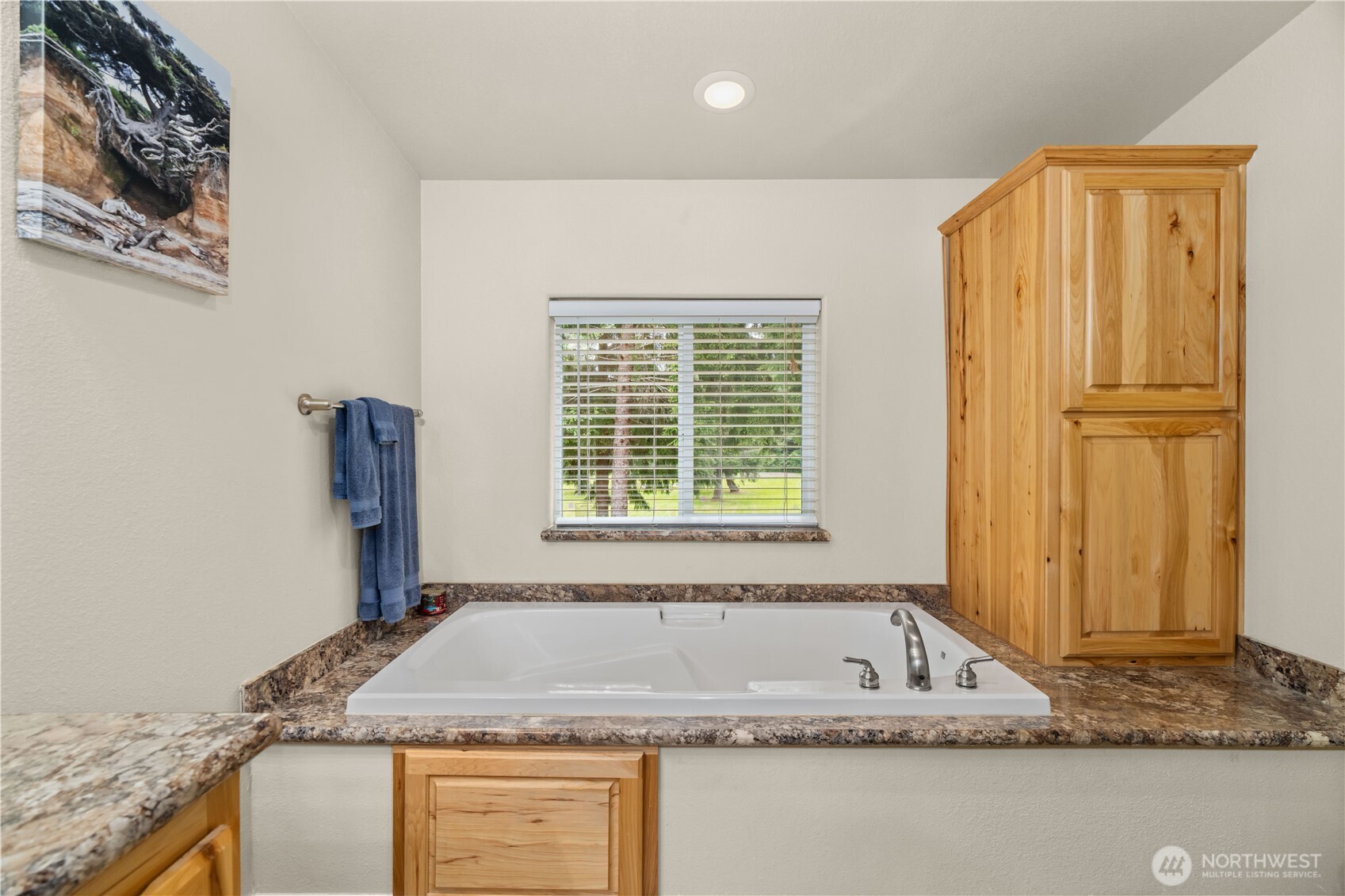 132 River Park Road Forks, WA 98331 - Photo 20 of 40 a bathroom with a granite countertop sink and a mirror