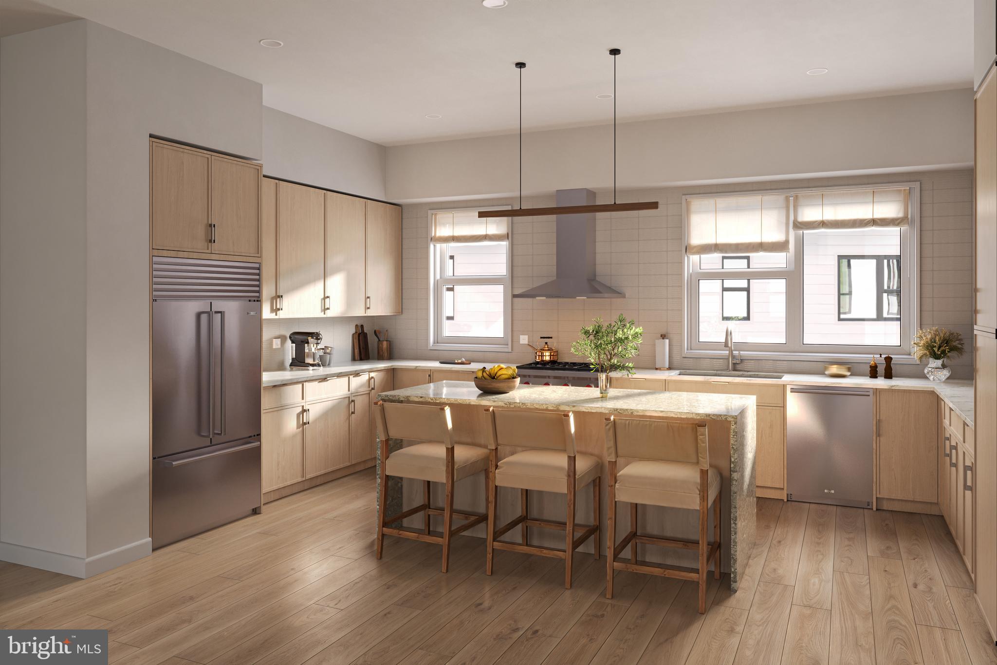 835 Fernon Street Philadelphia, PA 19148 - Photo 2 of 11 a kitchen with appliances cabinets and wooden floor