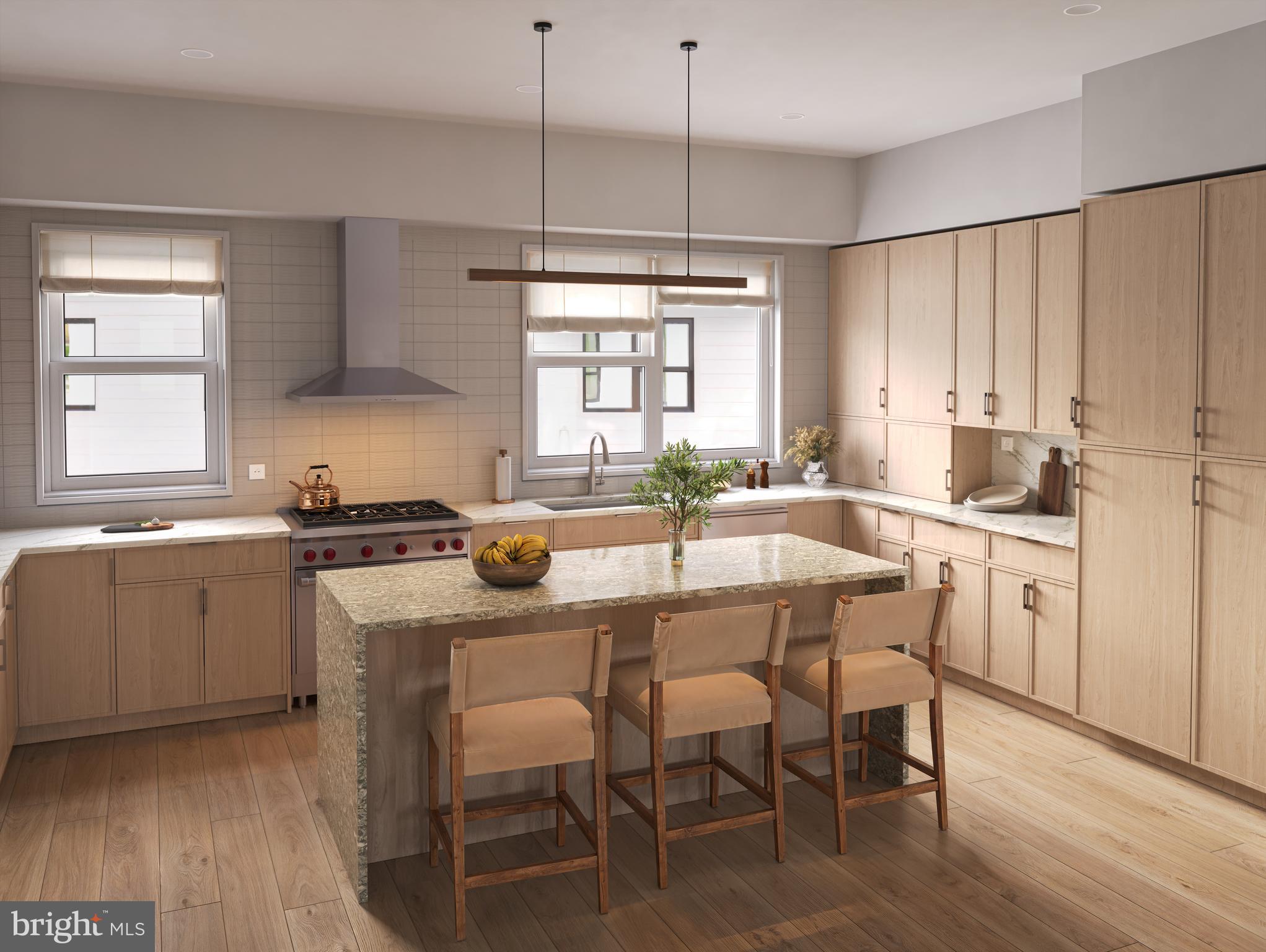 835 Fernon Street Philadelphia, PA 19148 - Photo 3 of 11 a kitchen with a dining table chairs and white cabinets