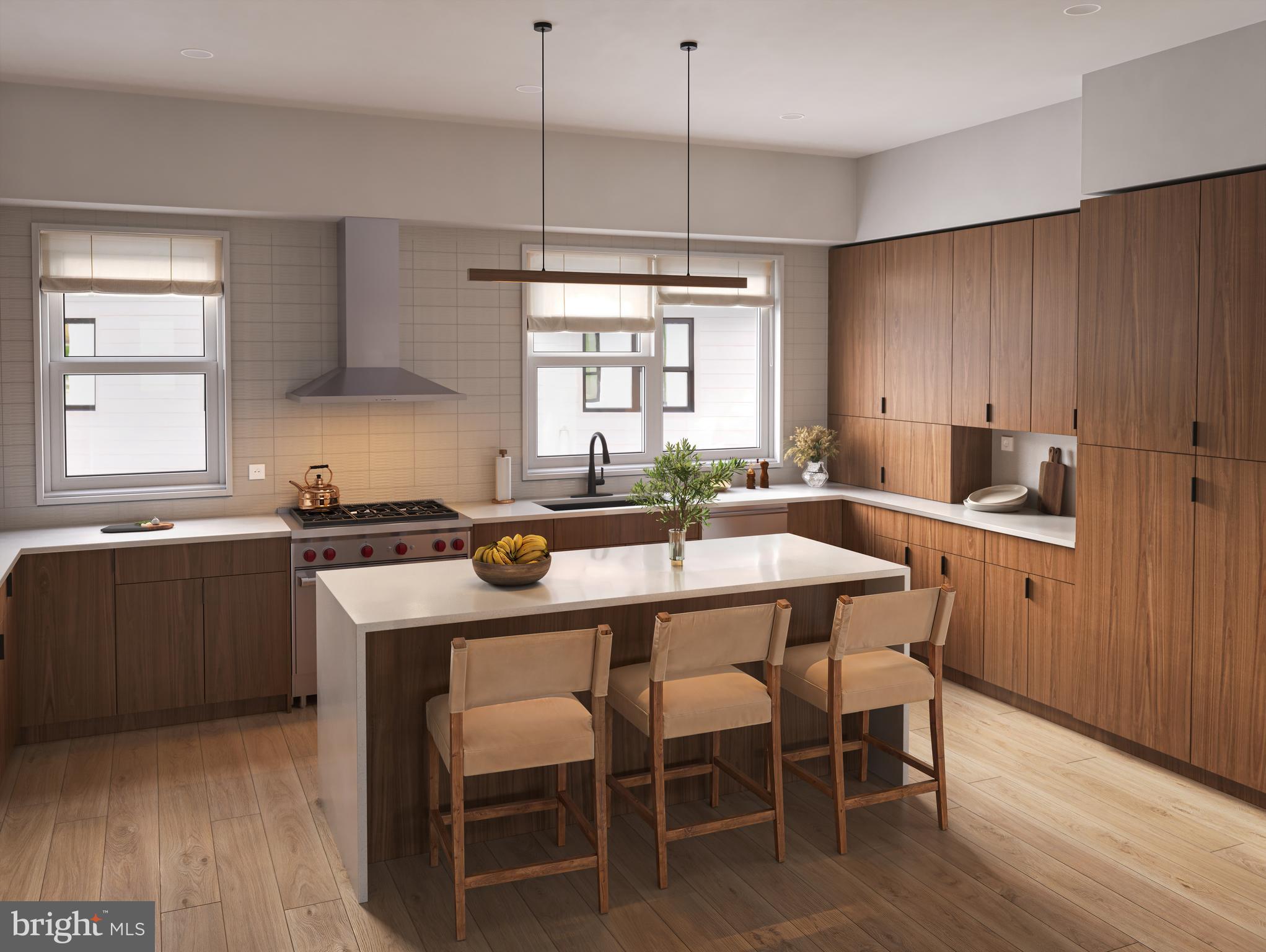 835 Fernon Street Philadelphia, PA 19148 - Photo 7 of 11 a kitchen with a dining table chairs and white cabinets