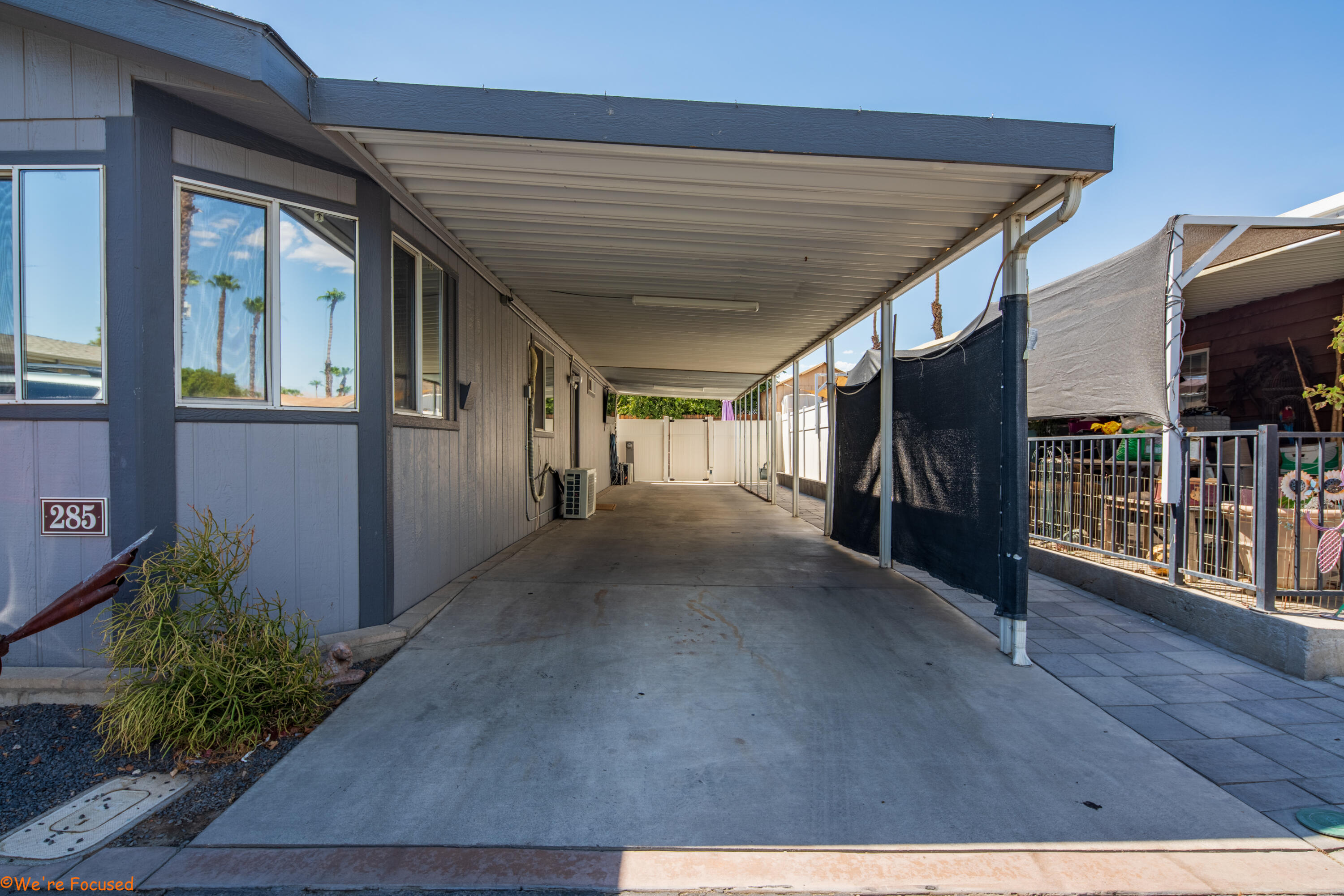 a view of a hallway with wooden floor and entryway