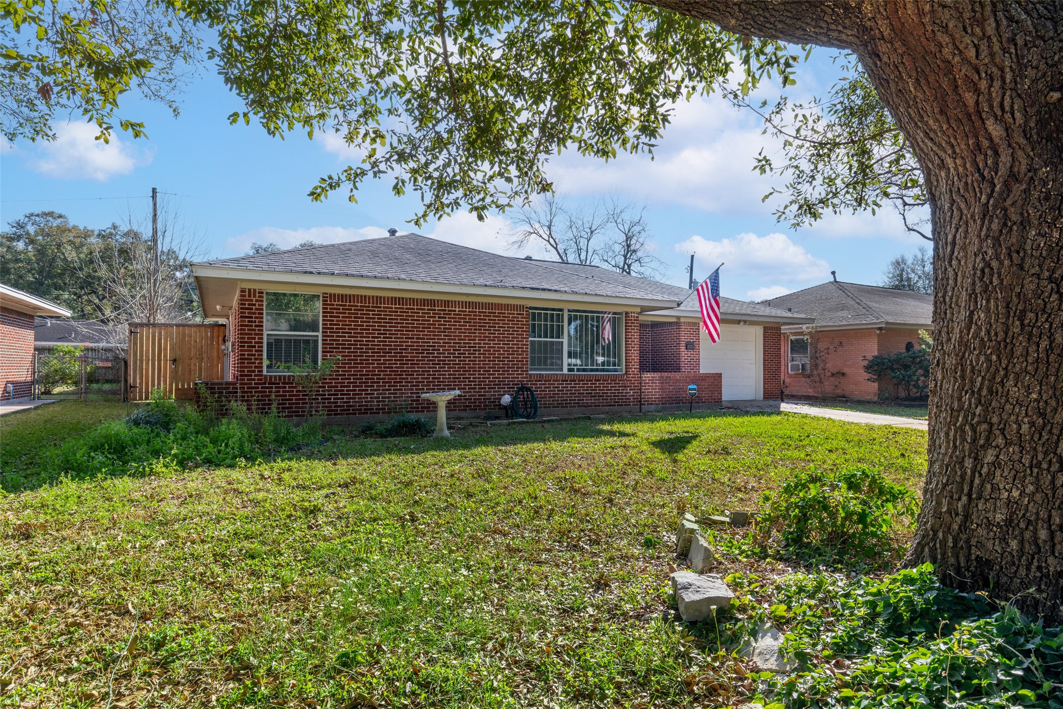 4709 Sanford Road Houston, TX 77035 - Photo 19 of 19 a front view of a house with garden