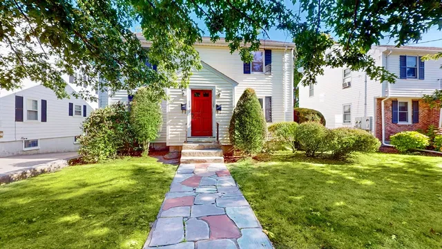 a front view of a house with a yard
