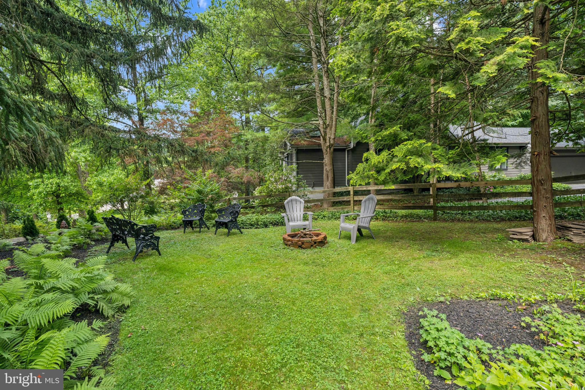 443 Homestead Road Wayne, PA 19087 - Photo 21 of 55 a view of backyard with a bench