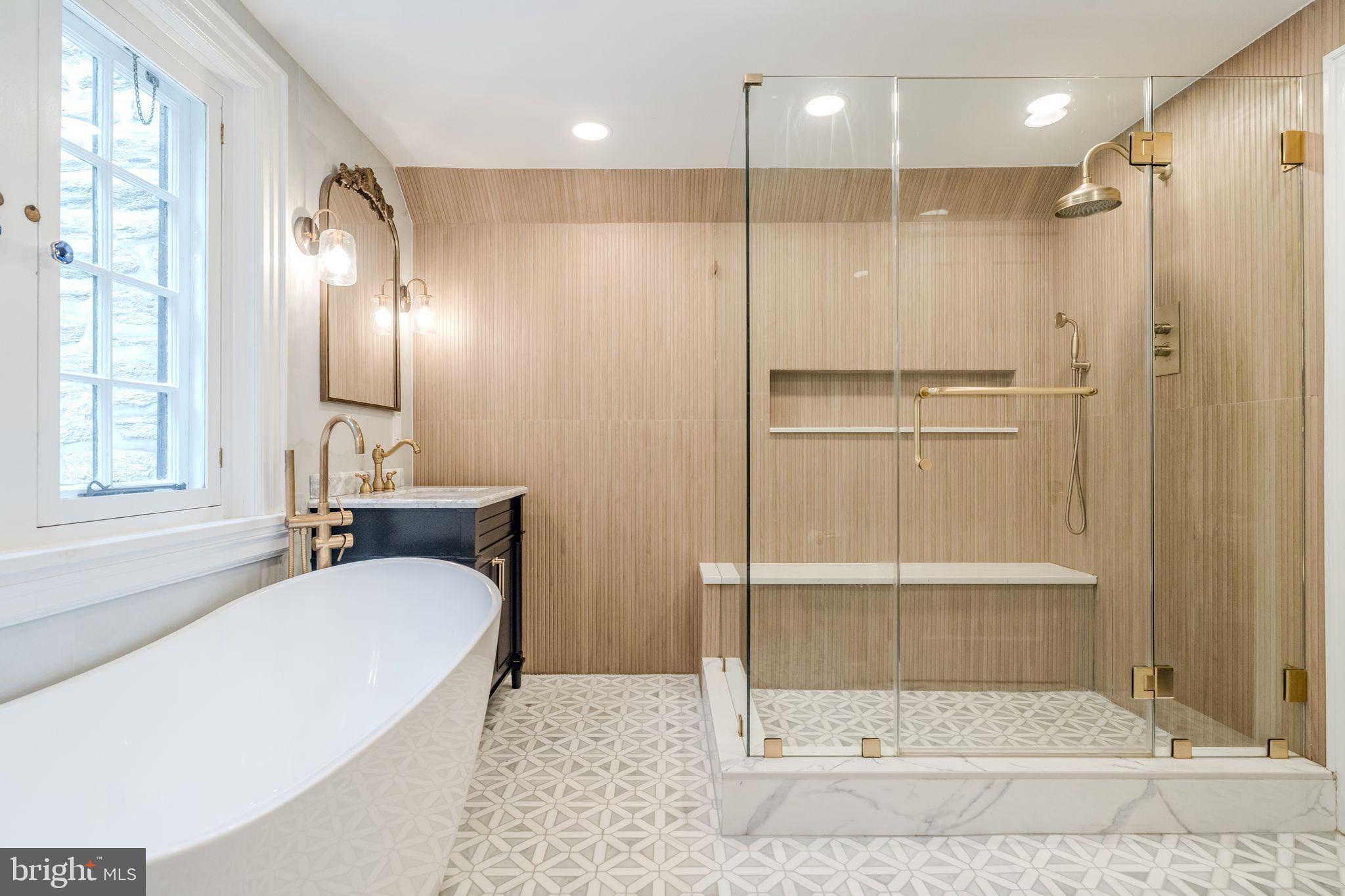 443 Homestead Road Wayne, PA 19087 - Photo 3 of 55 a bathroom with a tub sink shower and mirror