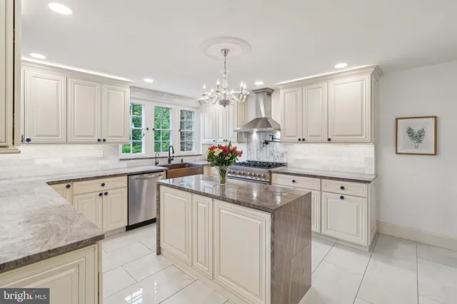 a kitchen with stainless steel appliances a refrigerator and a stove top oven