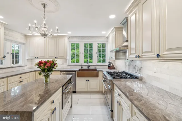 a view of a room with furniture and windows