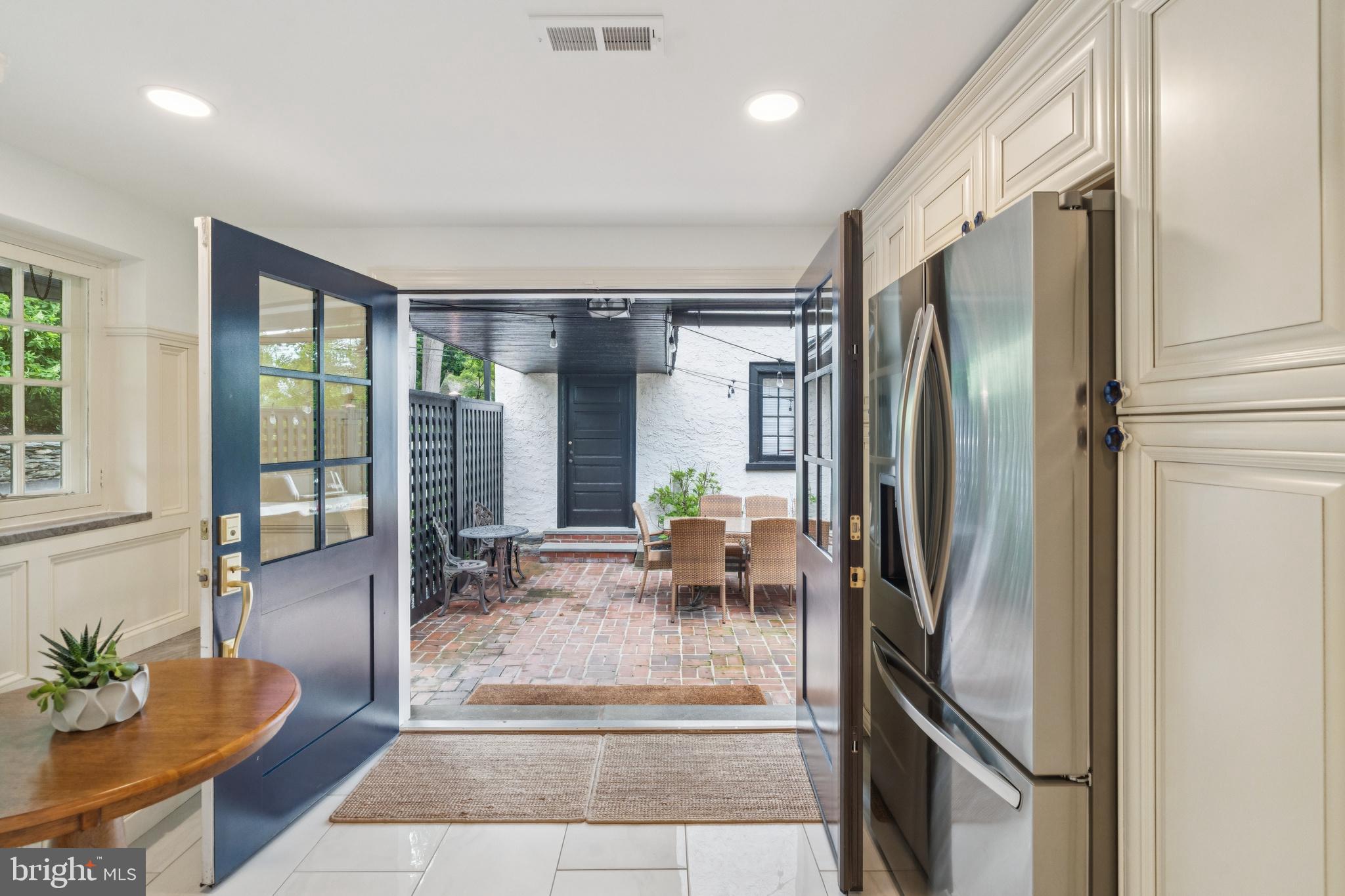 443 Homestead Road Wayne, PA 19087 - Photo 43 of 55 a living room with stainless steel appliances furniture a floor to ceiling window and wooden floor