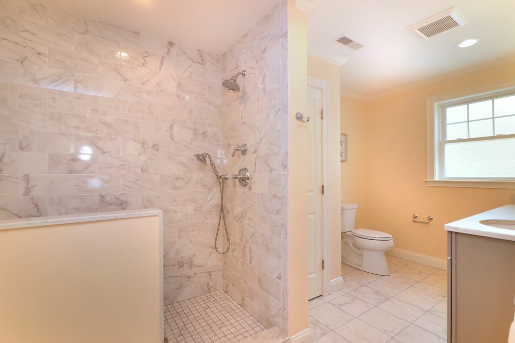 6 Tower Road Arlington, MA 02474 - Photo 19 of 30 a bathroom with a granite countertop sink toilet and shower